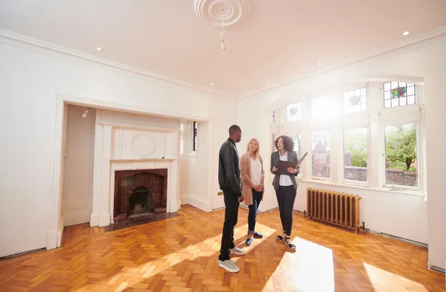 Real estate agent with clients viewing a house they are considering buying in Panama