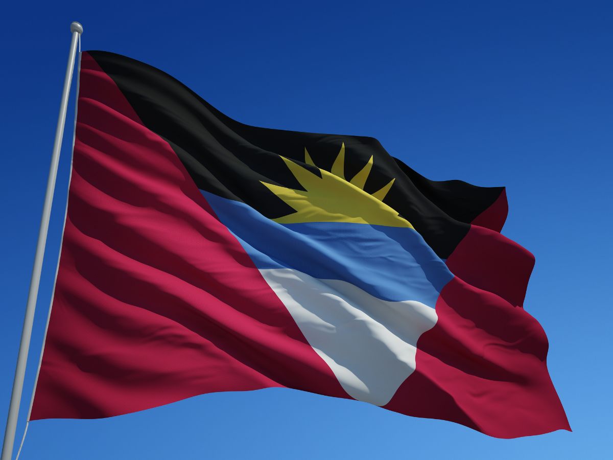 flag of Antigua & Barbuda flying in the sky