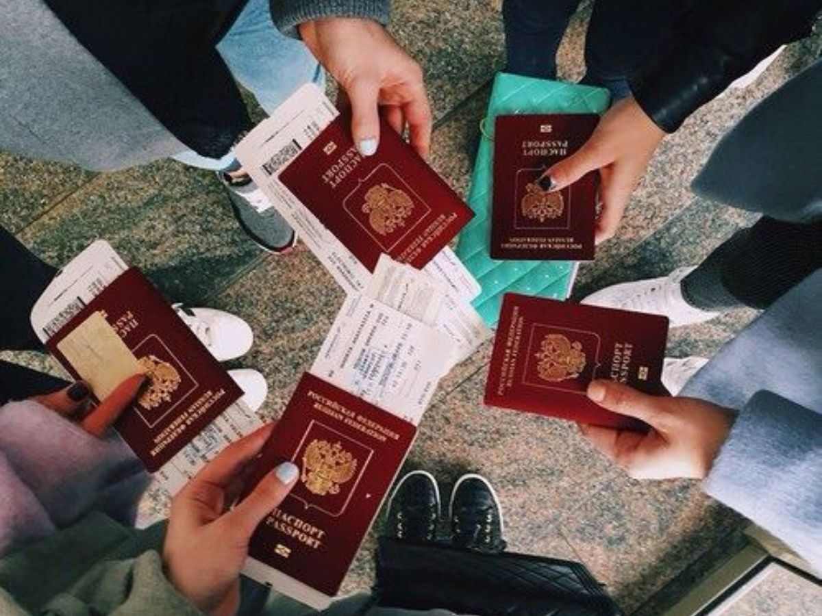 family holding passports and travel itineraries
