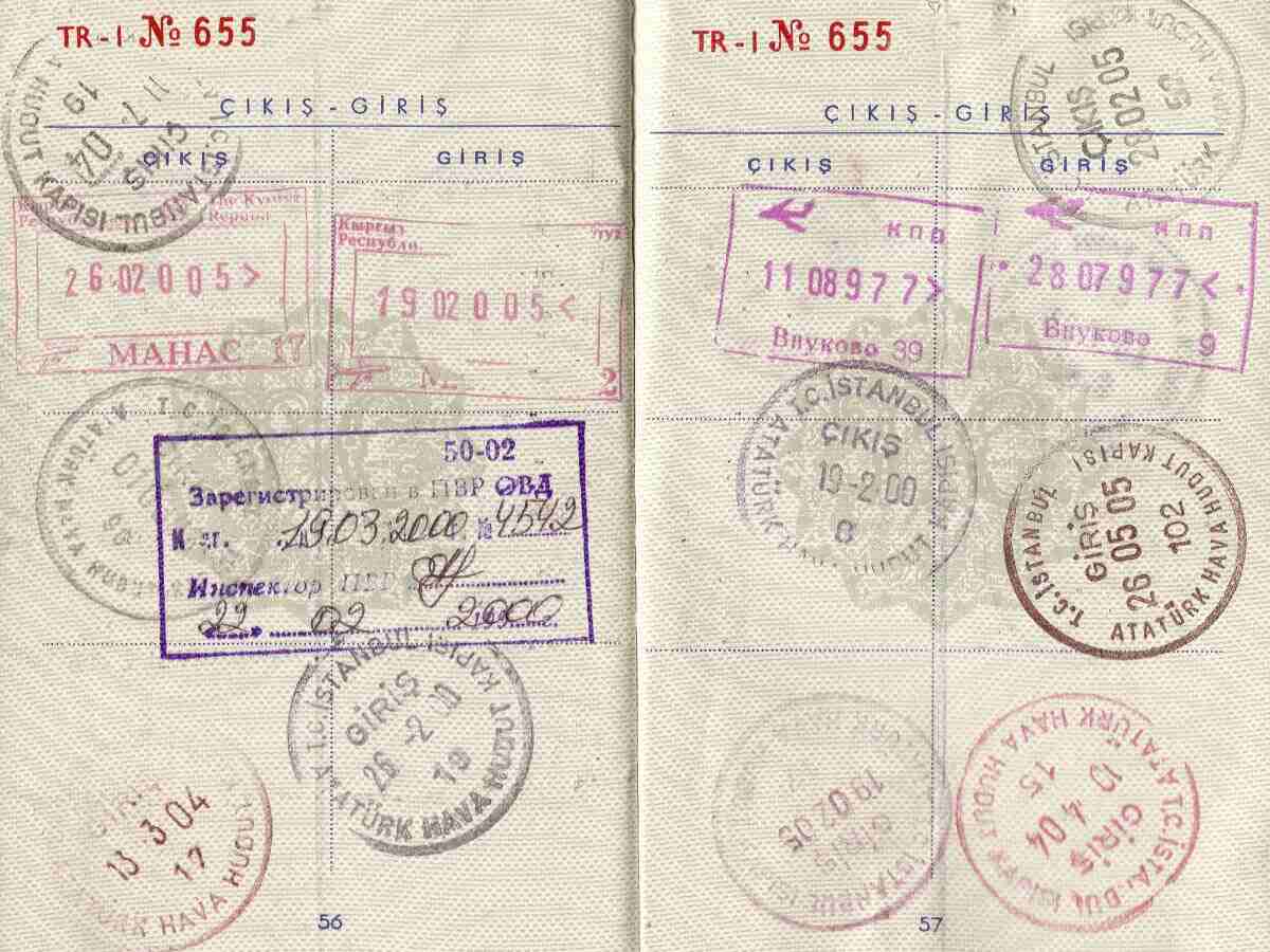 a passport stamped with visas and entry stamps
